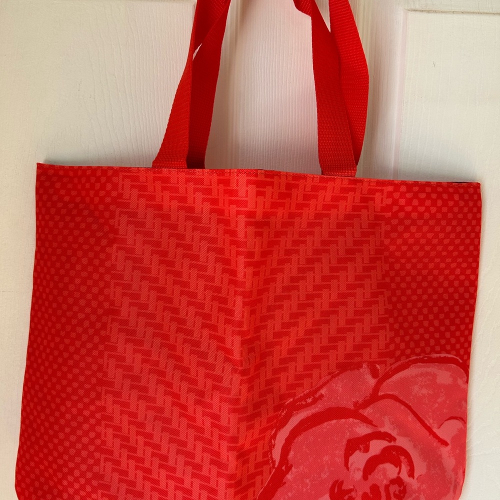 Vibrant Red Textured Lancôme Tote Bag with Decorative Flower